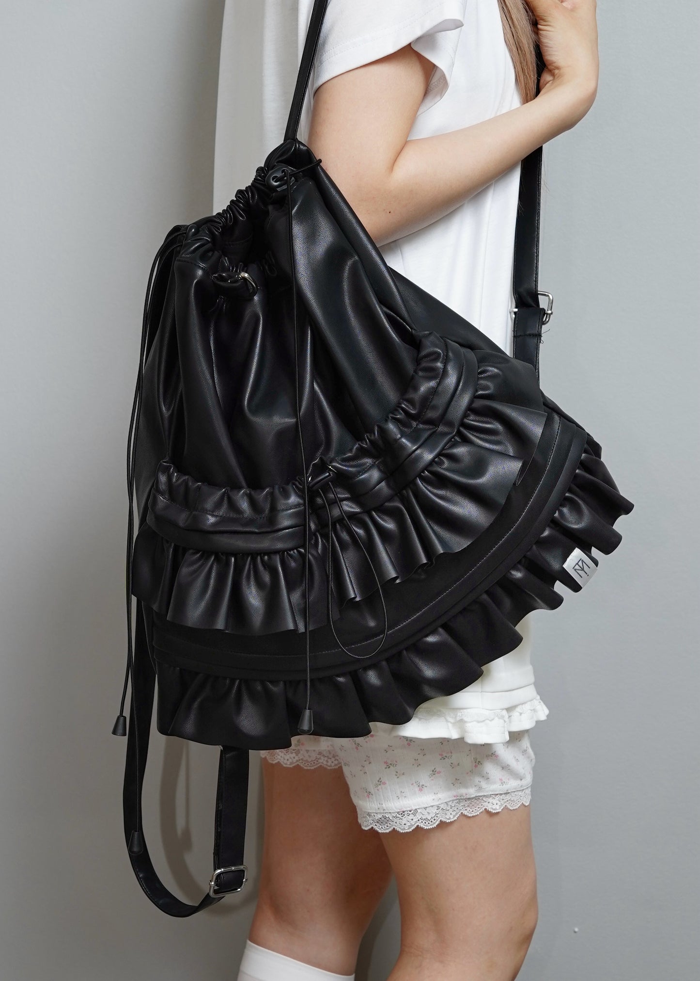 soft vegan leather frill knapsack