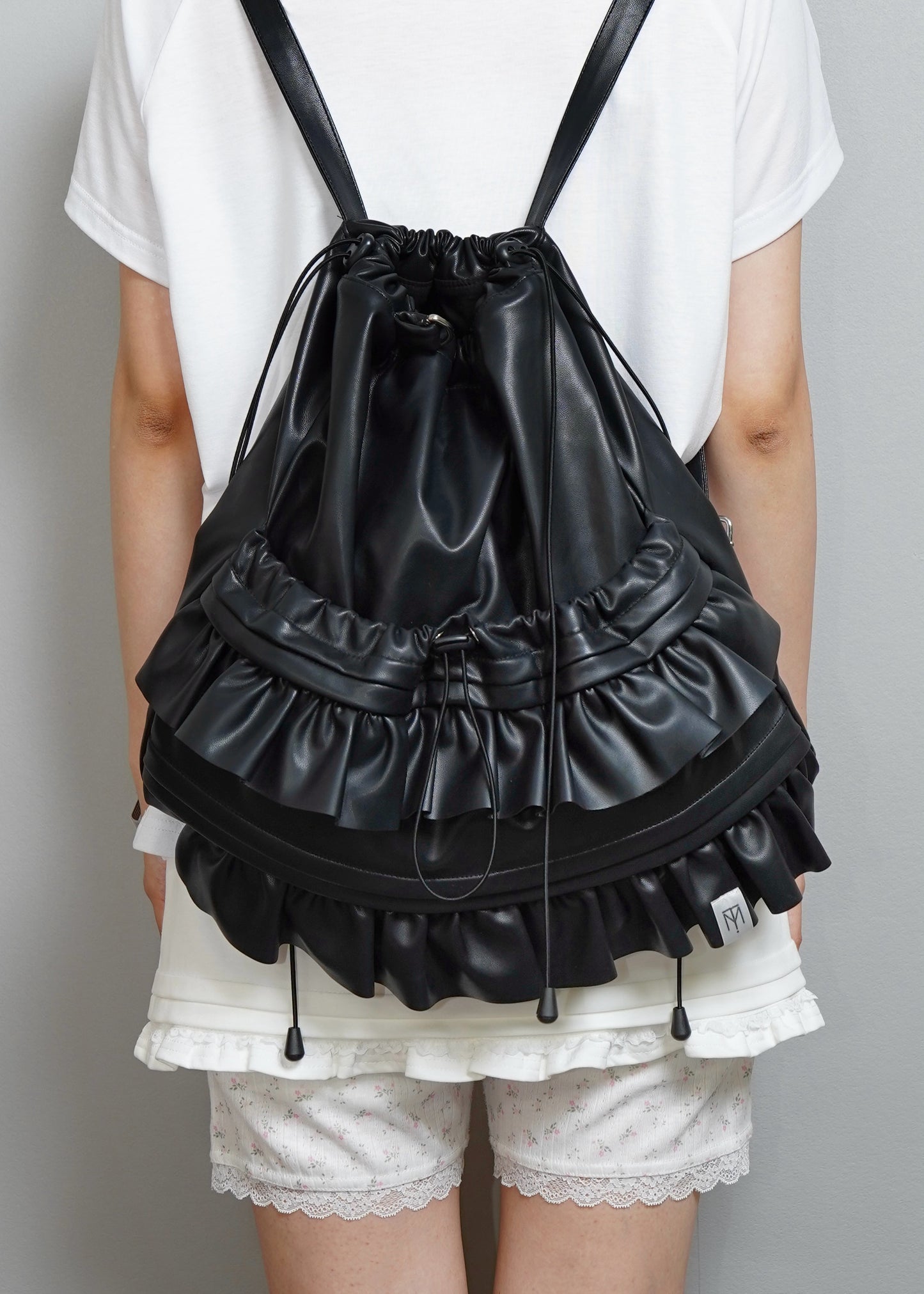 soft vegan leather frill knapsack